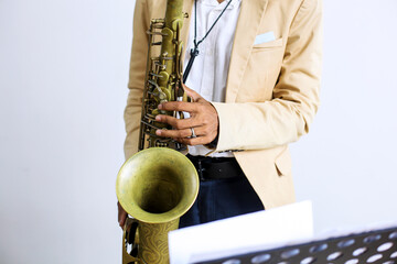 Close-up Fingers Pushing The Keys Playing Saxophone 