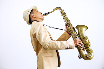 Young Male Playing Saxophone Isolated On White Background 