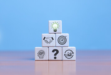 Businessman holding creative light bulb with industry and marketing development network icons. Strategic planning. Modern business and inspiration. Innovation idea.