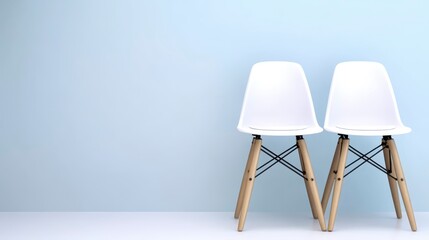 Modern Minimalist White Chairs Against Soft Blue Background