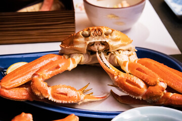 Japanese Steamed Snow Crab on a Blue Plate with Lemon
