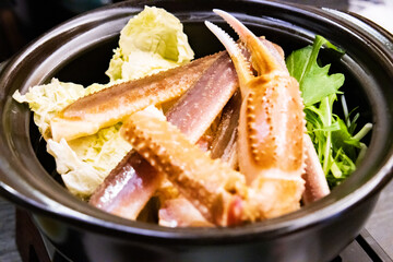 Steaming Snow Crab Legs in Hot Pot with Vegetables