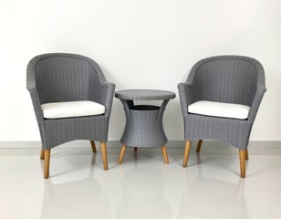 Elegant gray woven chairs and table set against a pristine white backdrop