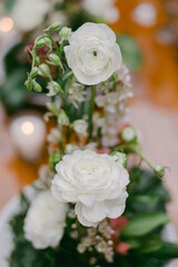 Elegant white flowers arranged beautifully for a special event centerpiece on a wooden table