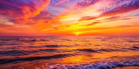 Fototapeta premium Vibrant orange and pink hues of a serene sunset over a tranquil ocean with gentle waves, sunset, water, sunset, water