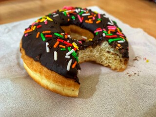 chocolate donuts with colorful ceres sprinkled on top