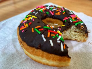 chocolate donuts with colorful ceres sprinkled on top
