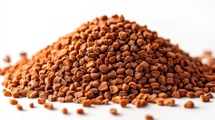 A pile of brown seeds on a white background, showcasing their texture.