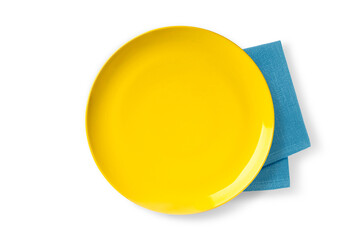 Empty yellow plate on kitchen napkin isolated on white background . Top view
