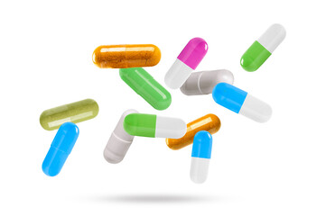 Falling colorful medicine pills isolated on white background.