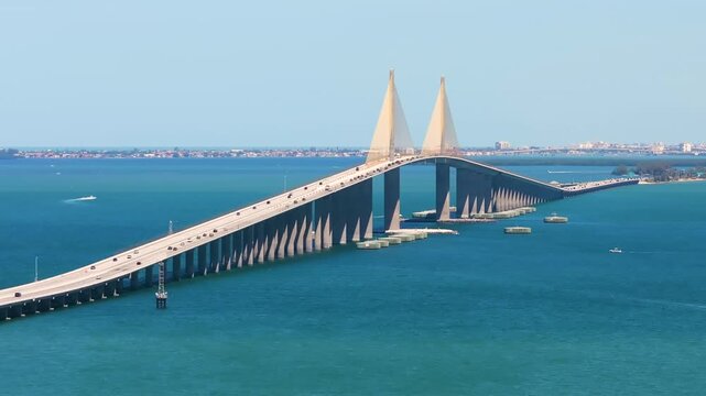 Highway road traffic driving over Sunshine Skyway Bridge in Florida. Transportation infrastructure in USA