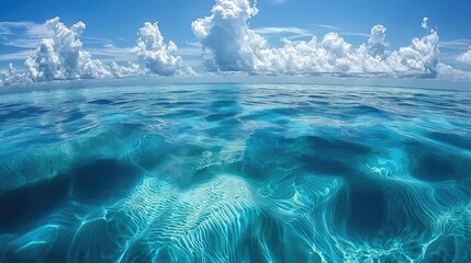 Tranquil Blue Ocean View Under a Bright Sky with White Clouds
