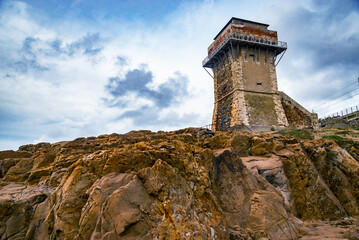 Calafuria Tower landmark on cliff rock and sea in winter. Tuscany, Italy, Europe