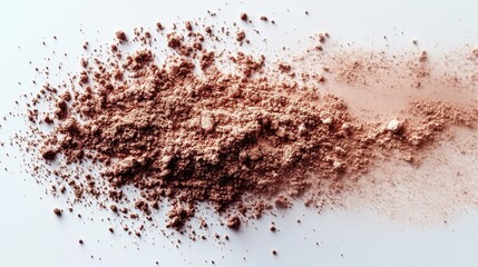 A pile of loose powder, possibly makeup or cosmetic product.
