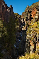 Russia, Elbrus region. The differences of the Kyzylkol mountain river with picturesque valleys and waterfalls at the foot of the highest mountain in the Caucasus - Elbrus (5642 m).