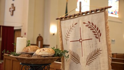 Communion Preparation  A Simple Arrangement of Bread, Candle, and Symbolic Banner in a House of Worship