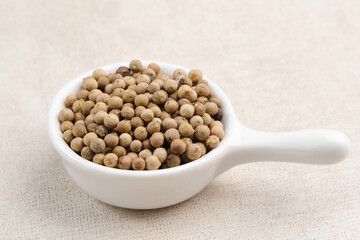 Aromatic and fresh white pepper on small bowl
