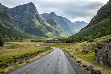 Mountainous landscape with empty asphalt road, desolate landscape, rugged terrain
