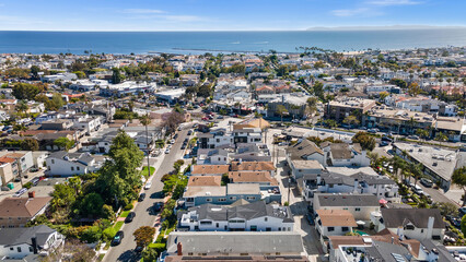 Obraz premium Luxury home, Newport Beach, ocean view, modern house, real estate, sunset photography, coastal property, high-end architecture, elegant design, premium listing, exterior lighting, waterfront home