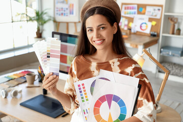 Female interior designer with color palettes in office