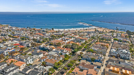 Naklejka premium Luxury home, Newport Beach, ocean view, modern house, real estate, sunset photography, coastal property, high-end architecture, elegant design, premium listing, exterior lighting, waterfront home