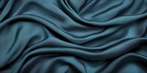 A close-up of luxurious teal fabric, showcasing its smooth texture and elegant drape, perfect for fashion or interior design applications.