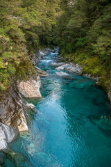 The clear pure turquoise water in the blue springs tourist attraction near Makaroa in Haast Pass en route to the West Coast