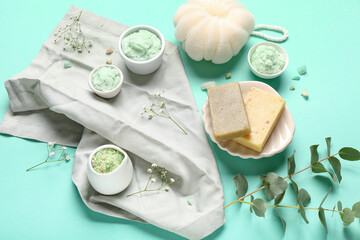 Composition with body scrub and bath supplies on color background
