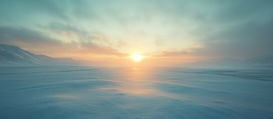 Obraz premium Serene sunset over a snow-covered, windswept arctic landscape.
