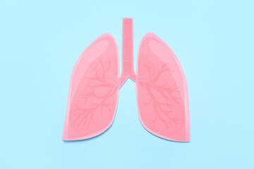 Paper lungs on blue background