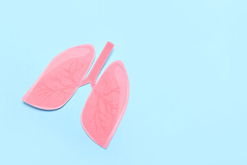 Paper lungs on blue background