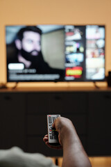 Holding Remote Control While Watching Television