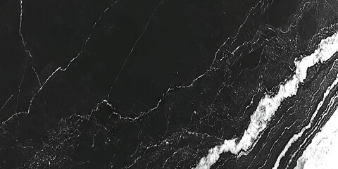 A deep charcoal black texture with soft highlights and subtle grain patterns