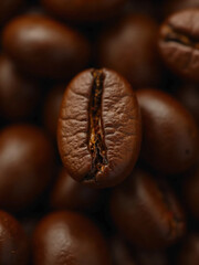 Fototapeta premium Close-Up of Roasted Coffee Beans – High-Resolution Macro Shots Showcasing Glossy Texture, Deep Brown Color, and Rich Aroma with Rustic Wooden Background and Soft Moody Lighting in Stunning Detail.