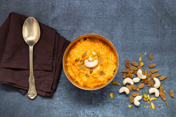 Gajar ka halwa is a rich Indian dessert made with grated carrots, milk, sugar, ghee, and nuts, slow-cooked to perfection.