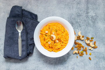 Gajar ka halwa is a rich Indian dessert made with grated carrots, milk, sugar, ghee, and nuts, slow-cooked to perfection.