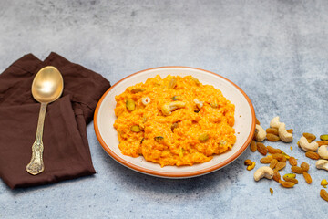 Gajar ka halwa is a rich Indian dessert made with grated carrots, milk, sugar, ghee, and nuts, slow-cooked to perfection.