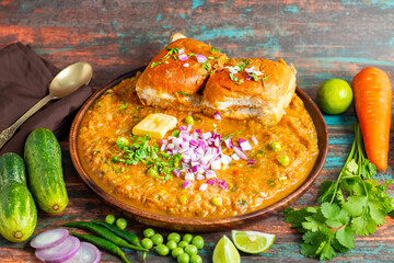Pav Bhaji is a spiced vegetable mash served with soft, buttered bread rolls, offering a hearty, comforting street food experience.