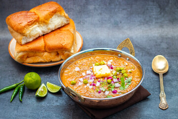 Pav Bhaji is a spicy, mashed vegetable curry served with soft buttered bread rolls, a popular street food in India.