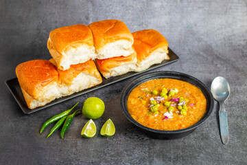 Pav bhaji is a spicy, buttery vegetable mash served with soft, toasted bread rolls, creating a satisfying and hearty meal.