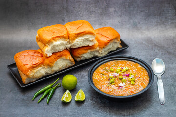 Pav Bhaji is a spicy, mashed vegetable curry served with soft buttered bread rolls, offering a comforting, savory experience.