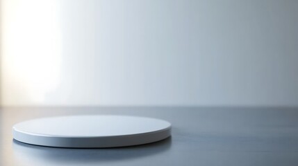 White Circular Platform Against Light Grey Background