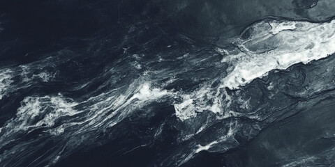 Fototapeta premium A deep charcoal black texture with soft highlights and subtle grain patterns