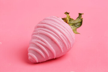strawberries in chocolate on a pink background