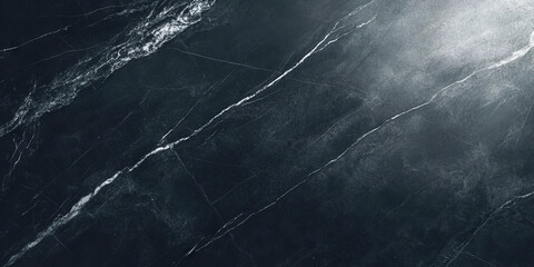 A deep charcoal black texture with soft highlights and subtle grain patterns