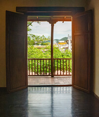 View from an Open Window in a Colonial Museum in Santa Marta, Colombia, Showcasing Local Heritage...