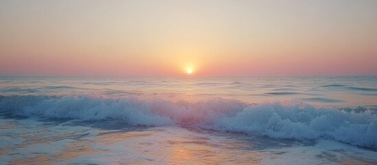 Fototapeta premium Serene sunrise over gentle ocean waves.