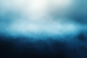 Blurry background with a smooth gradient from dark blue to light grey