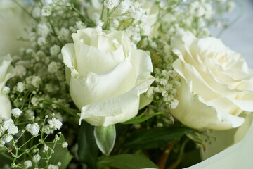 Wedding bouquet of white roses and gypsophila