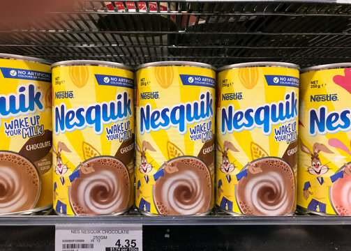 South Australia, Australia &ndash; Circa January, 2025: Row of cans of Nesquik on supermarket shelf with chocolate flavour